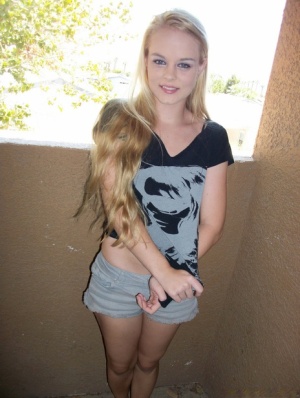 Young amateur Bri Skies exposes herself out on the balcony of her condo Amateur hot photo #1