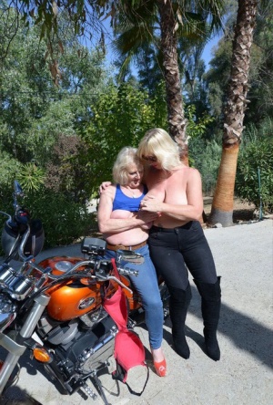 Older blonde lesbians go topless outdoors on a motorcycle #15