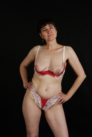 Horny granny with small saggy boobs peels red lingerie to pose naked #3
