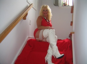 Aged blonde amateur Ruth goes topless in a mirror while wearing stripper boots xxx gallery #5