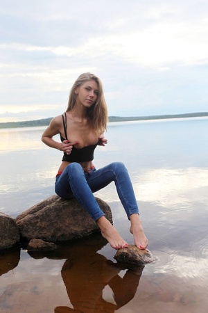 Girl next door Megan pulls out her tits while sitting on a rock in the lake sex gallerie #16