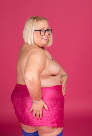 Blonde fatty Lexie Cummings models topless in glasses and stockings #3