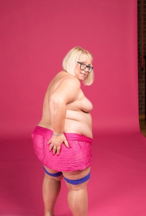 Blonde fatty Lexie Cummings models topless in glasses and stockings #6
