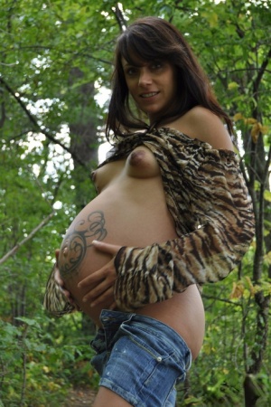 Pregnant amateur Brianna shows tits and twat plus swollen belly in the woods #9