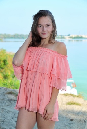Nice teen Harley gets naked on a blanket down by the water #1