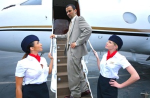 Clothed stewardesses seduce a businessman for a threesome inside a plane #1