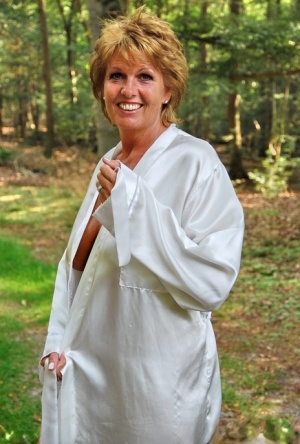 Older redhead removes a robe to stand naked in red heels while in the woods xxx tube picture #3